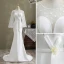 Mode Ivory / Creme Meerjungfrau Brautkleider / Hochzeitskleider 2021 Rundhalsausschnitt Pailletten Schleife Spitze Blumen Lange Ärmel Rückenfreies Sweep / Pinsel Zug Hochzeit