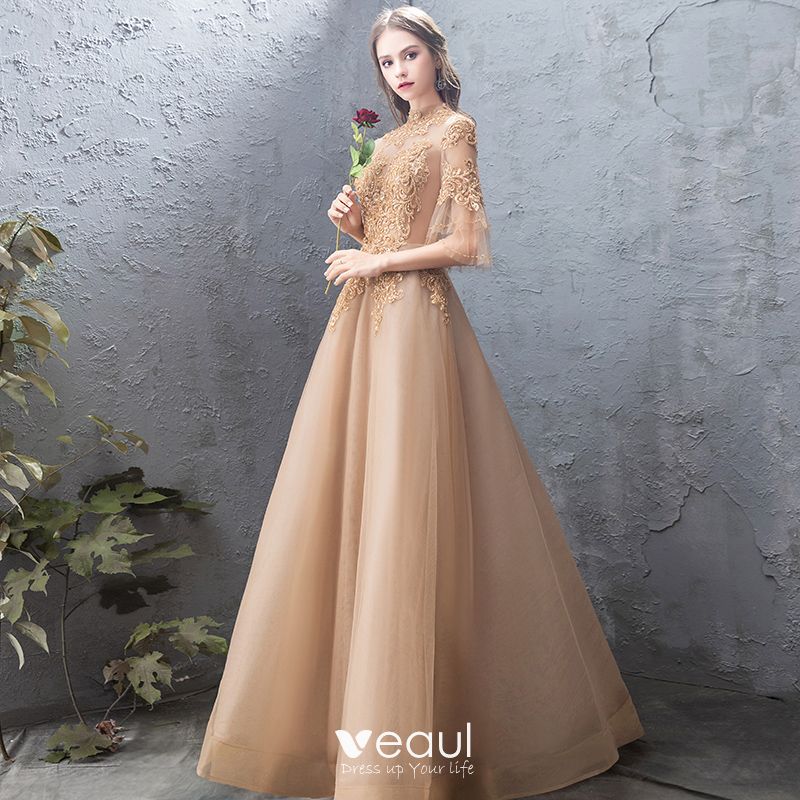 gold evening gown with sleeves