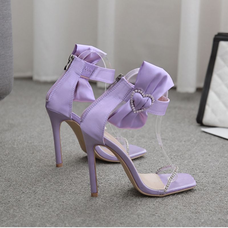 purple high heels with bow