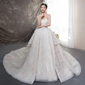 Bling Bling Champagne Wedding Dresses 2019 Ball Gown Sweetheart Sleeveless Backless Bow Glitter Tulle Cathedral Train Ruffle